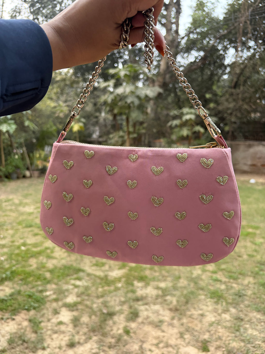 Pink hearts embroidered shoulder bag.