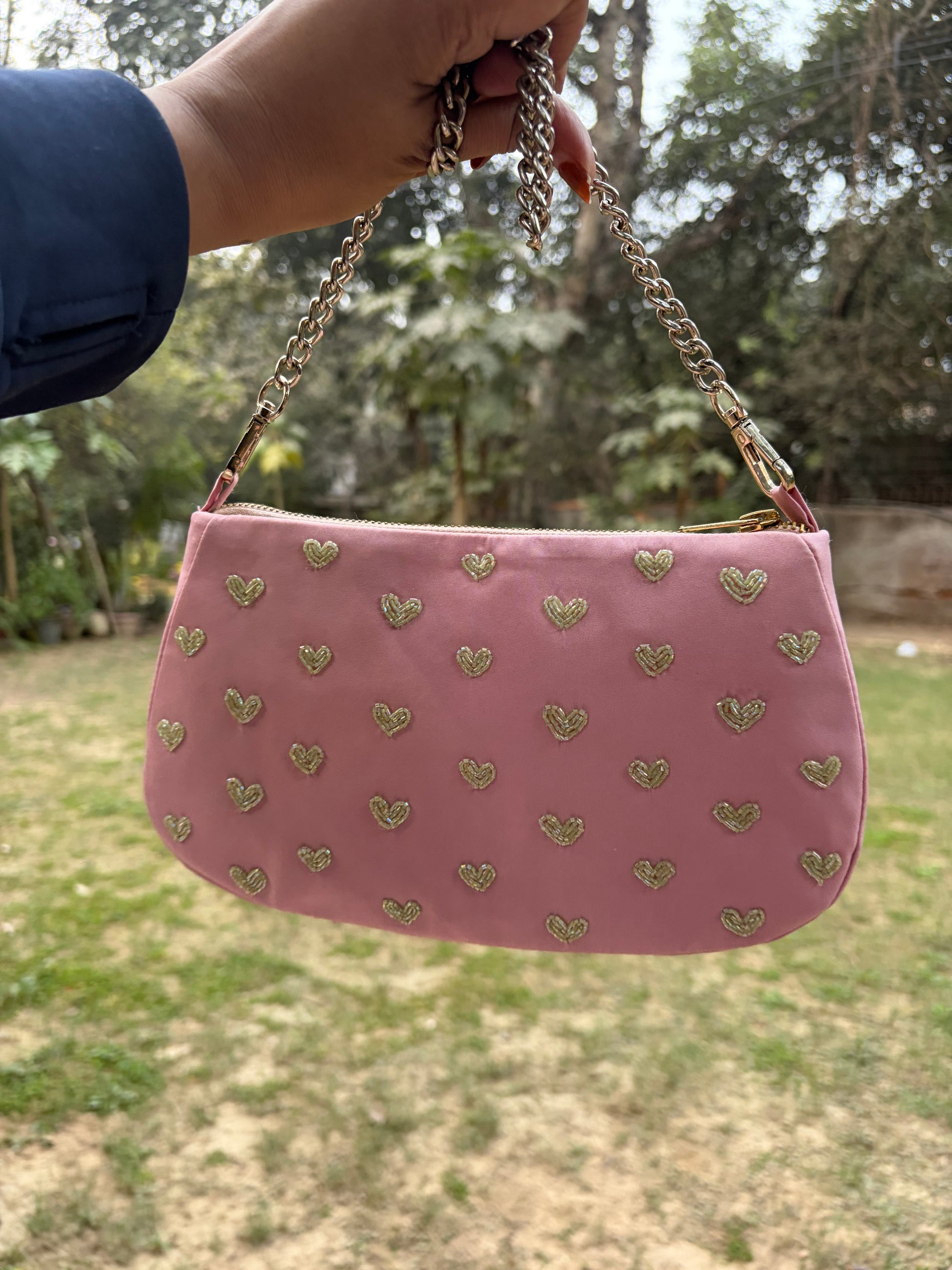 Pink hearts embroidered shoulder bag.