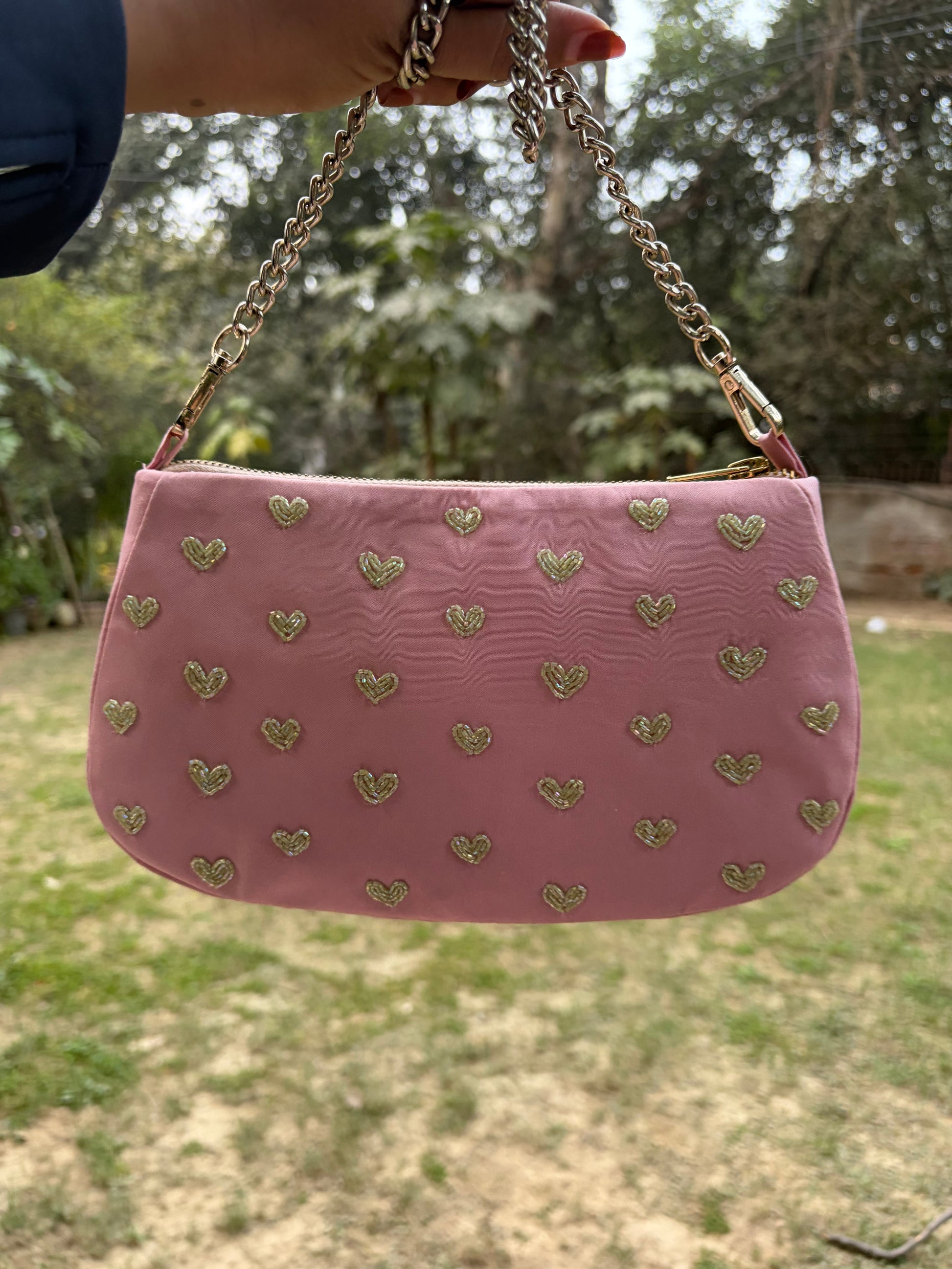 Pink hearts embroidered shoulder bag.