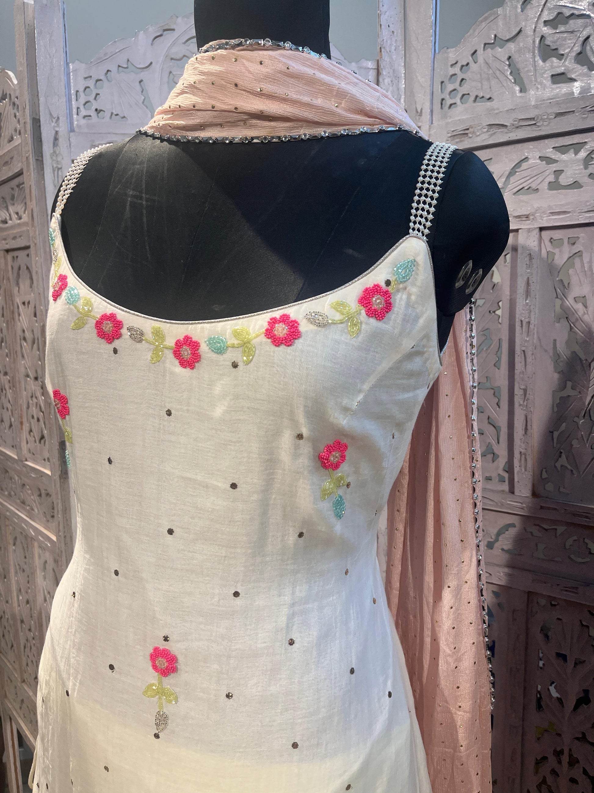 White embroidered top with floral patterns designerwear for wedding functons
