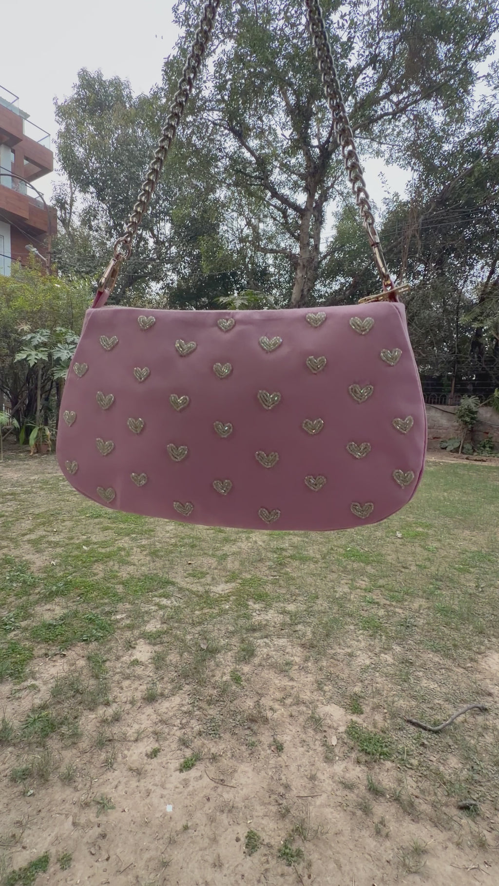 Pink hearts embroidered shoulder bag.