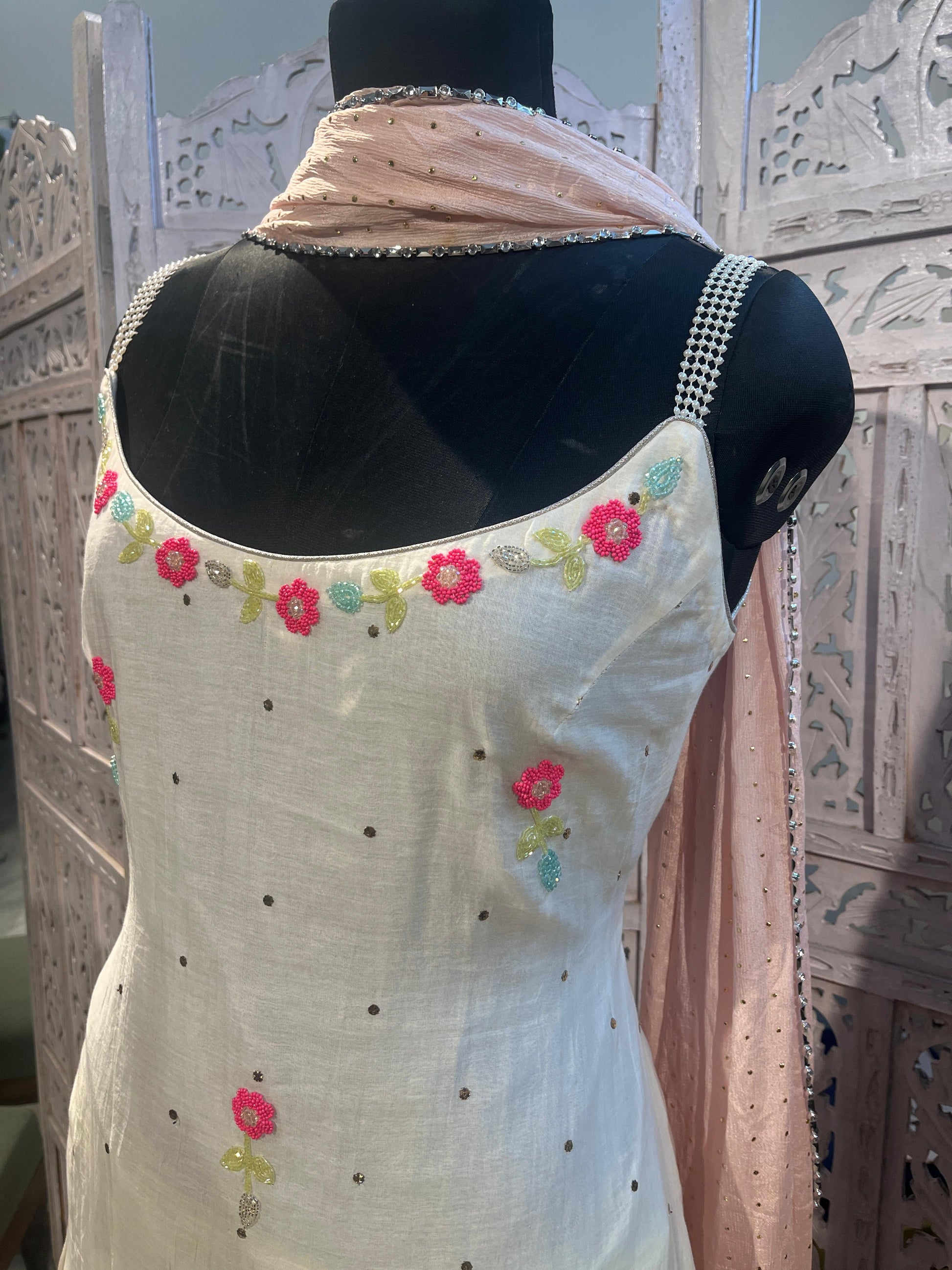 White embroidered kurta suit with floral patterns in pure silk